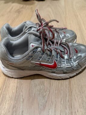 Nike Kids Silver Sneakers with Red Swoosh